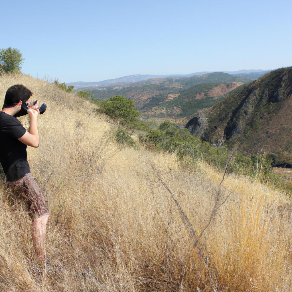 Person photographing scenic natural landscapes